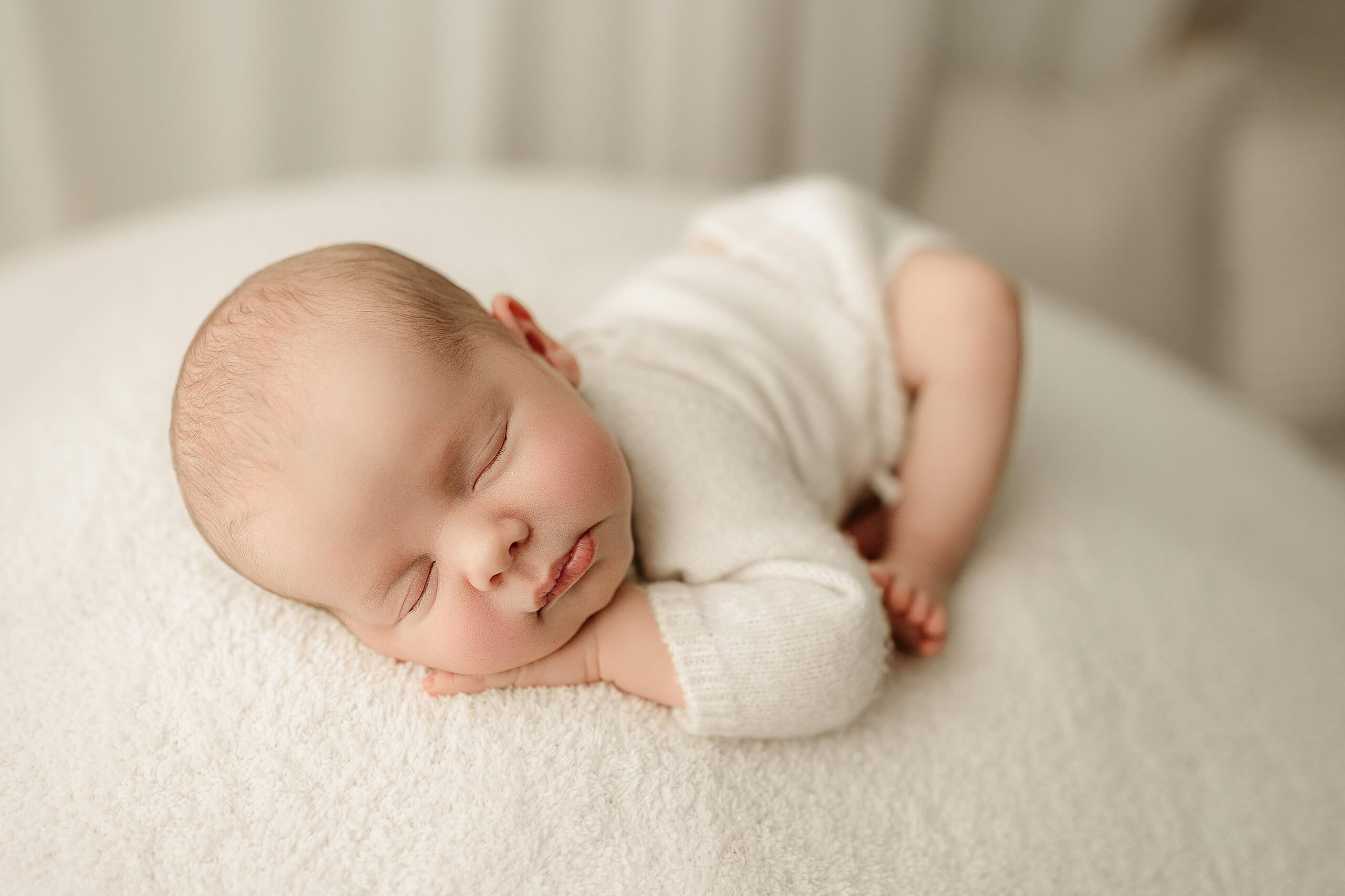 Newborn baby photographed during a professional newborn photography session in the Jacksonville area
